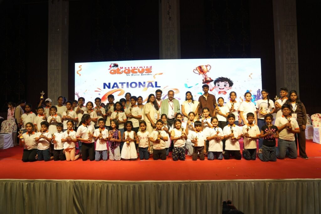 Mastermind Abacus student celebrating with trophy at National Gala 2026